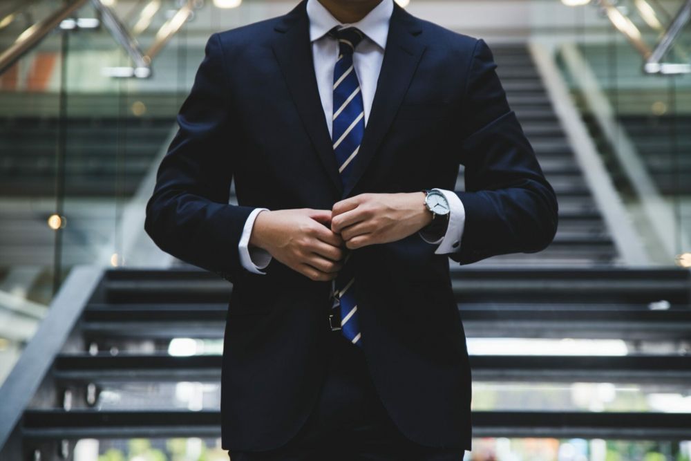 Attorney in a suit on staircase